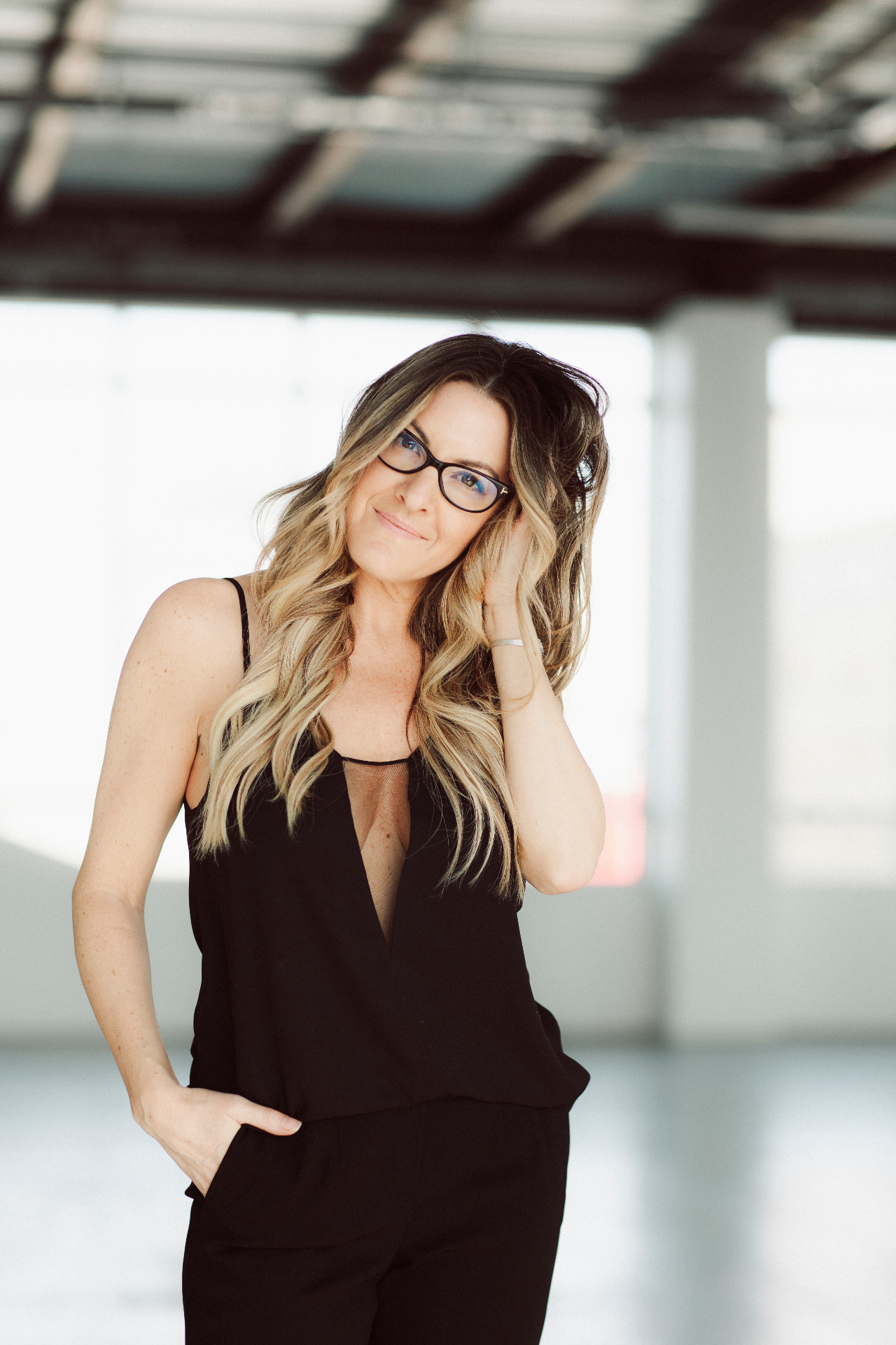 Mackenzie Archibald, RSW, in a sunlit loft space.